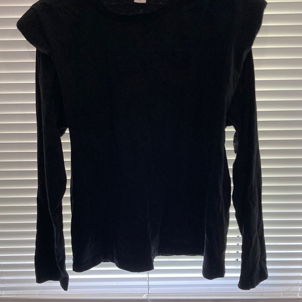 Black long sleeve with shoulder pads.